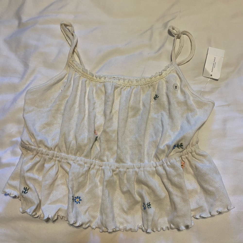 Floral American eagle tank top, never worn with tags, crop top, size small.